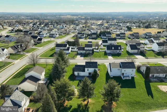 an aerial view of a house with a swimming pool