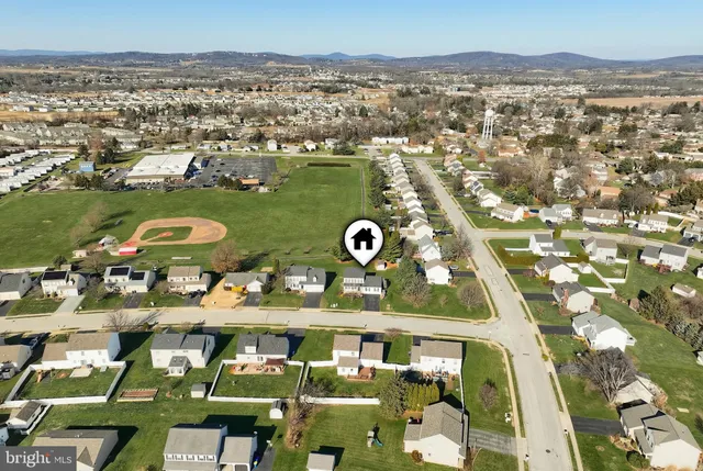 an aerial view of a house with a swimming pool