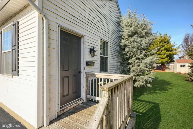 a balcony view with a backyard space