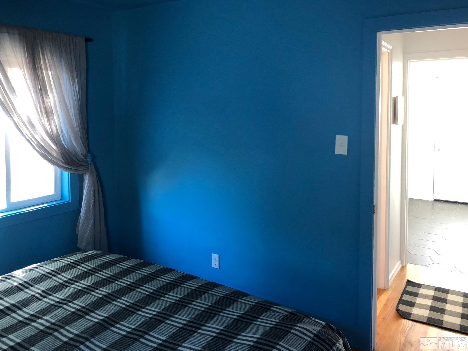 380 Broadway Boulevard Reno, NV 89502 - Photo 16 of 28 a bedroom with a bed and a window