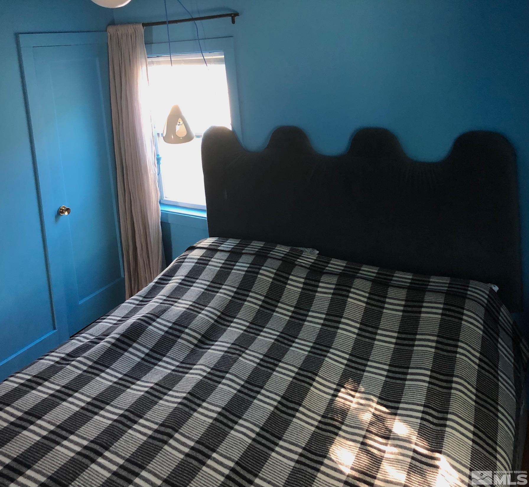 380 Broadway Boulevard Reno, NV 89502 - Photo 17 of 28 a bedroom with a bed and window