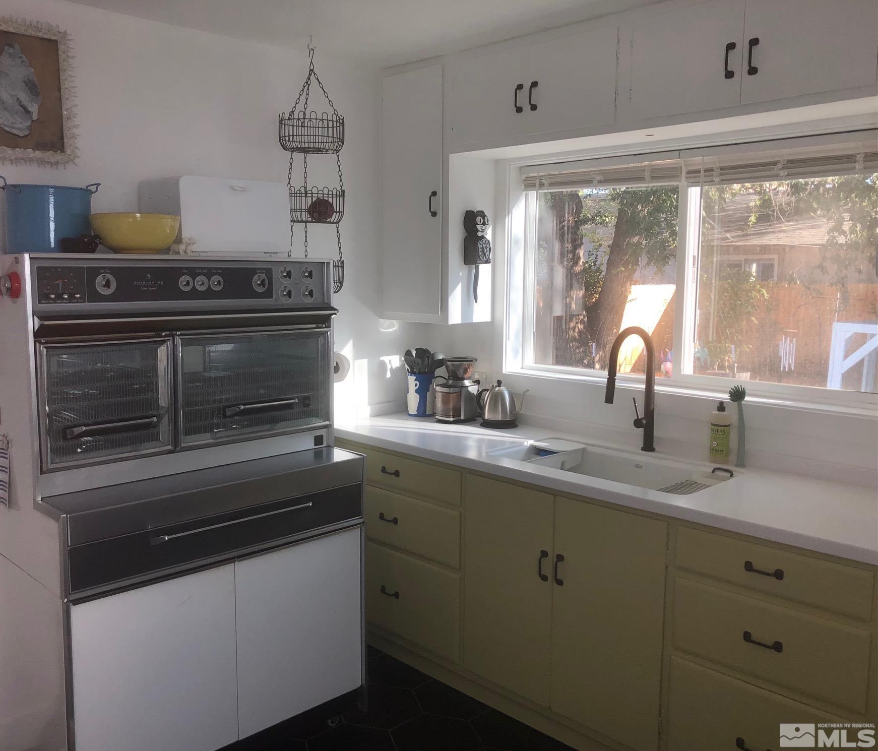 380 Broadway Boulevard Reno, NV 89502 - Photo 23 of 28 a kitchen with appliances a sink and cabinets