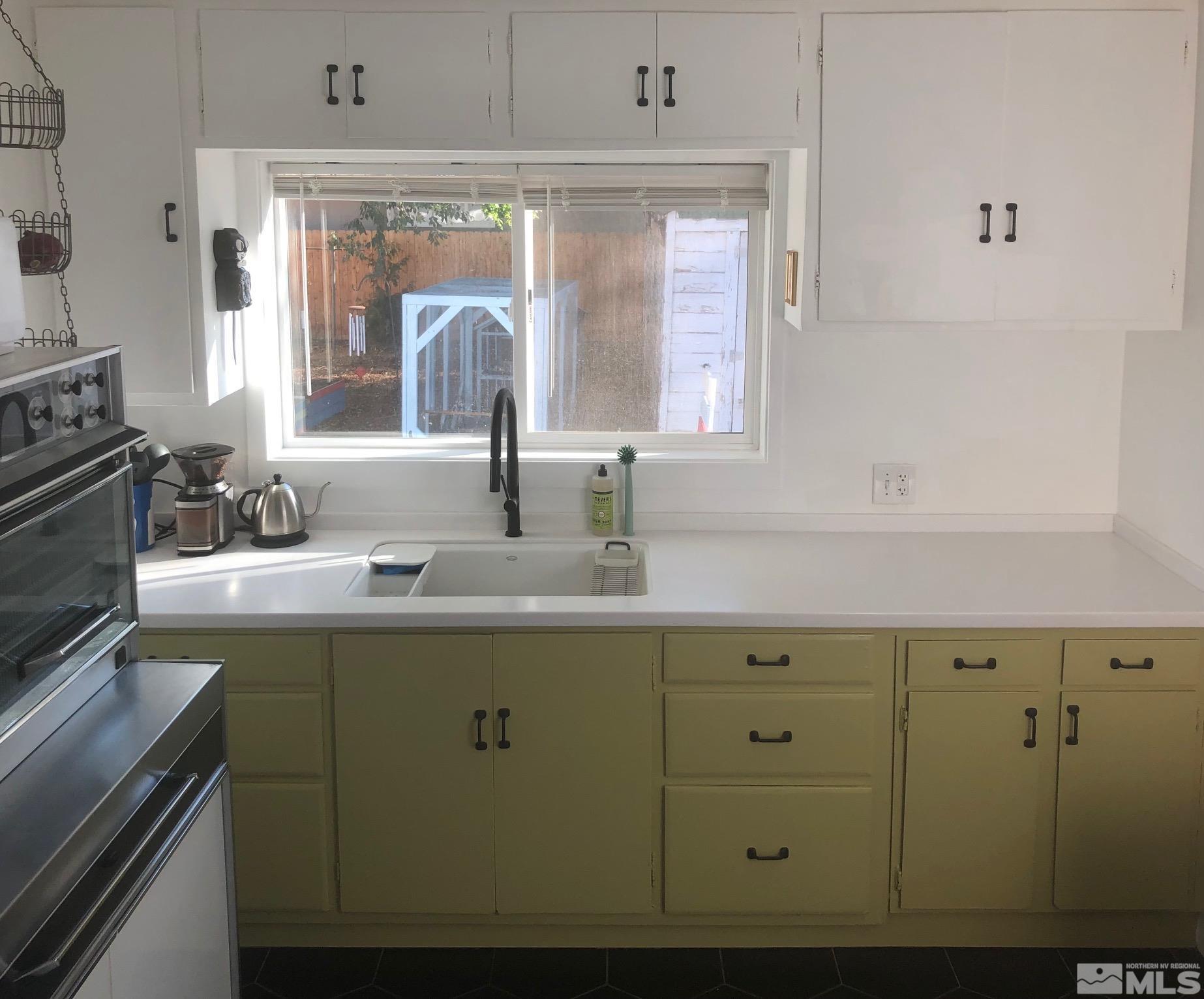 380 Broadway Boulevard Reno, NV 89502 - Photo 24 of 28 a kitchen with cabinets window and stainless steel appliances