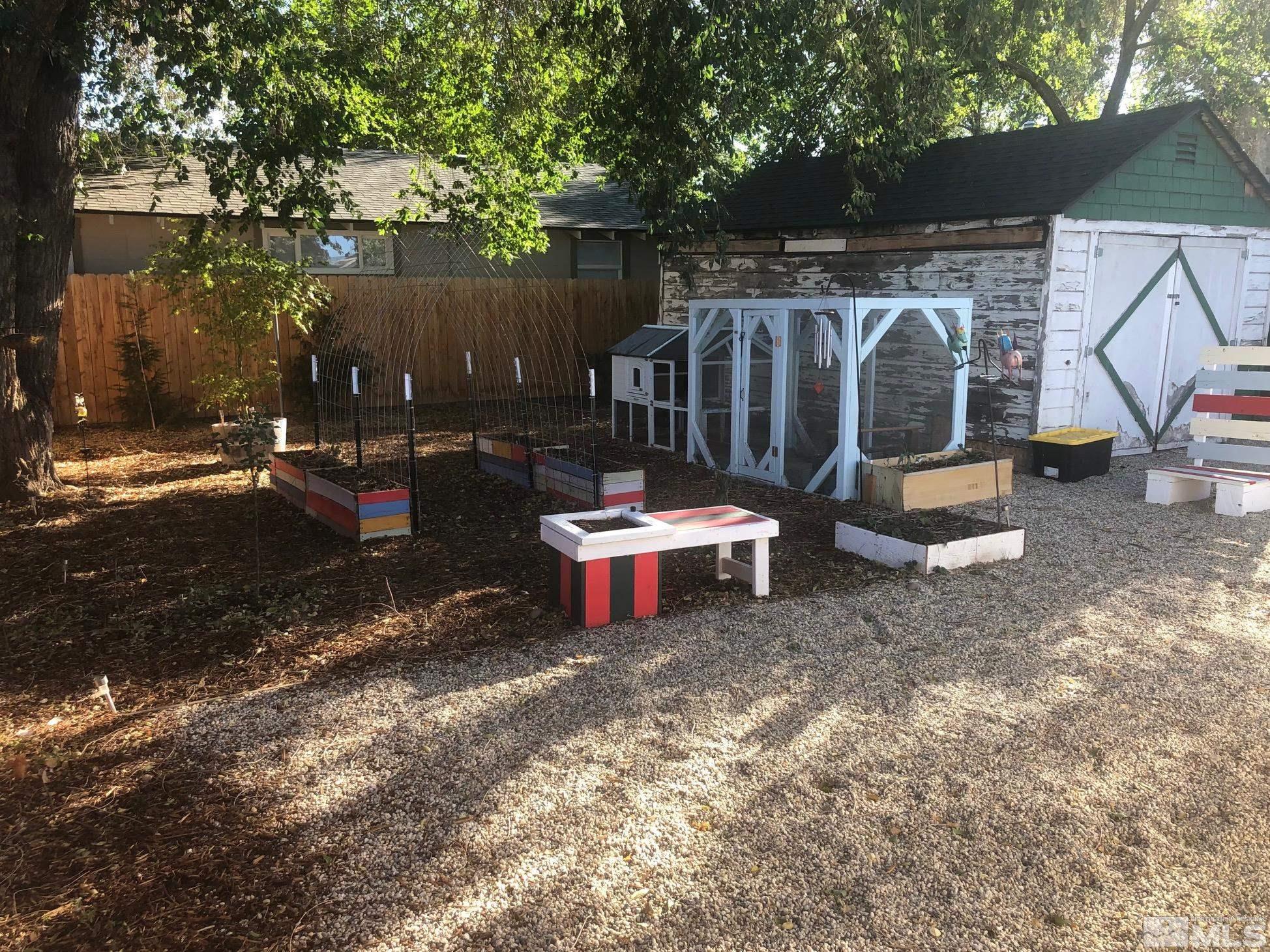 380 Broadway Boulevard Reno, NV 89502 - Photo 28 of 28 a view of a backyard with a small cabin and a chair