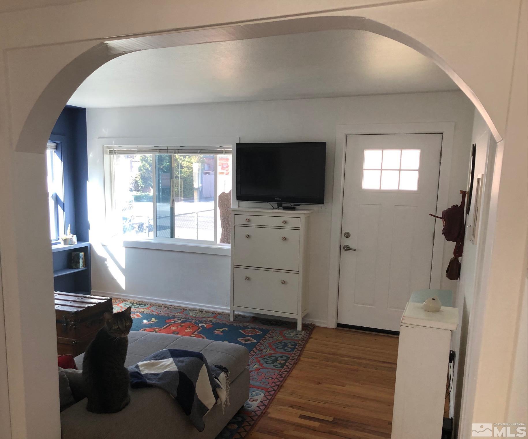 380 Broadway Boulevard Reno, NV 89502 - Photo 4 of 28 a bedroom with window and flat screen tv