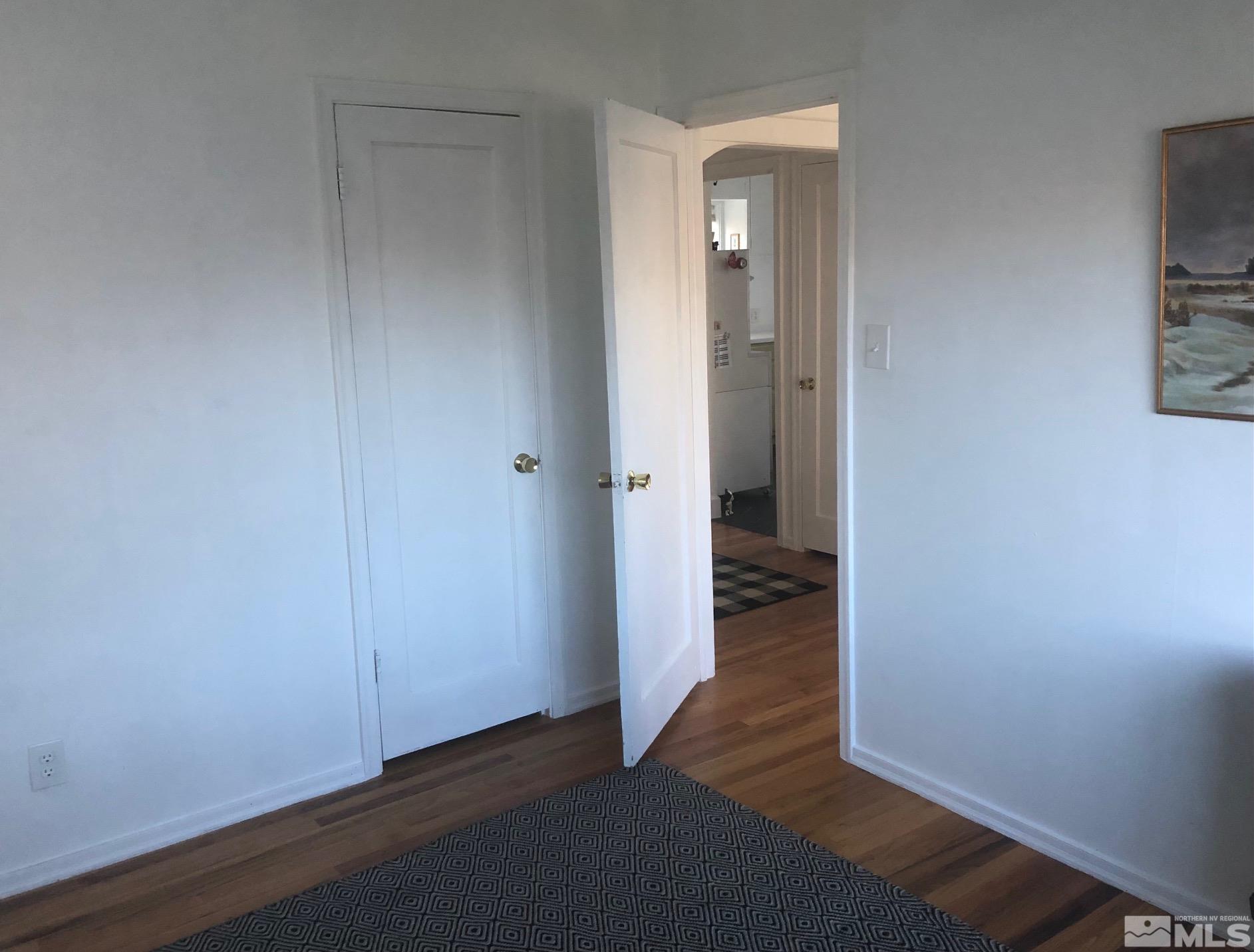 380 Broadway Boulevard Reno, NV 89502 - Photo 7 of 28 an empty room with wooden floor