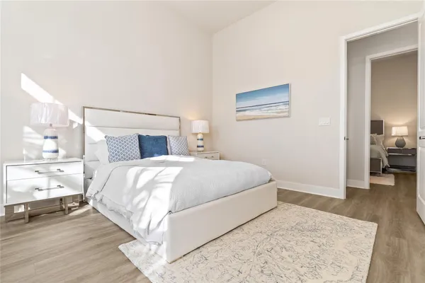 a bedroom with a bed and a view of bedroom