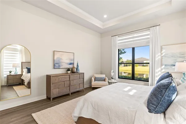 a bedroom with a large bed and a window