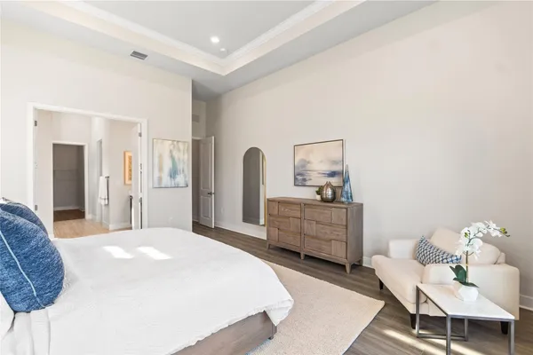 a bedroom with a bed and a dresser