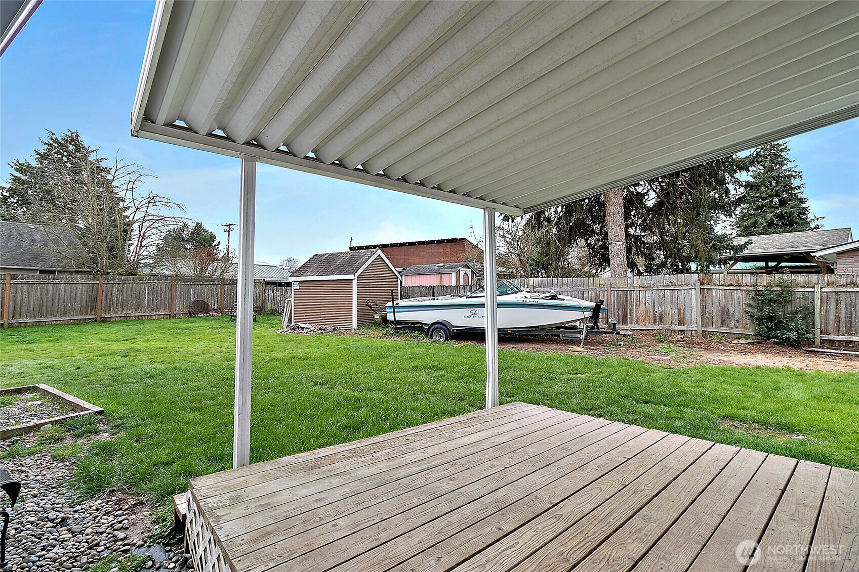 7308 Riverside Road East Sumner, WA 98390 - Photo 17 of 24 a view of a backyard with wooden floor