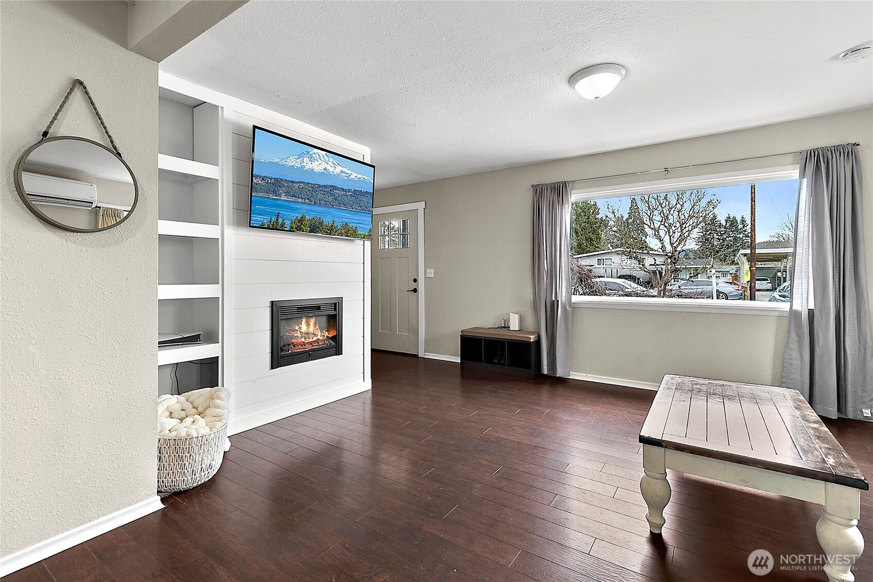 7308 Riverside Road East Sumner, WA 98390 - Photo 7 of 24 a living room with furniture and a fireplace