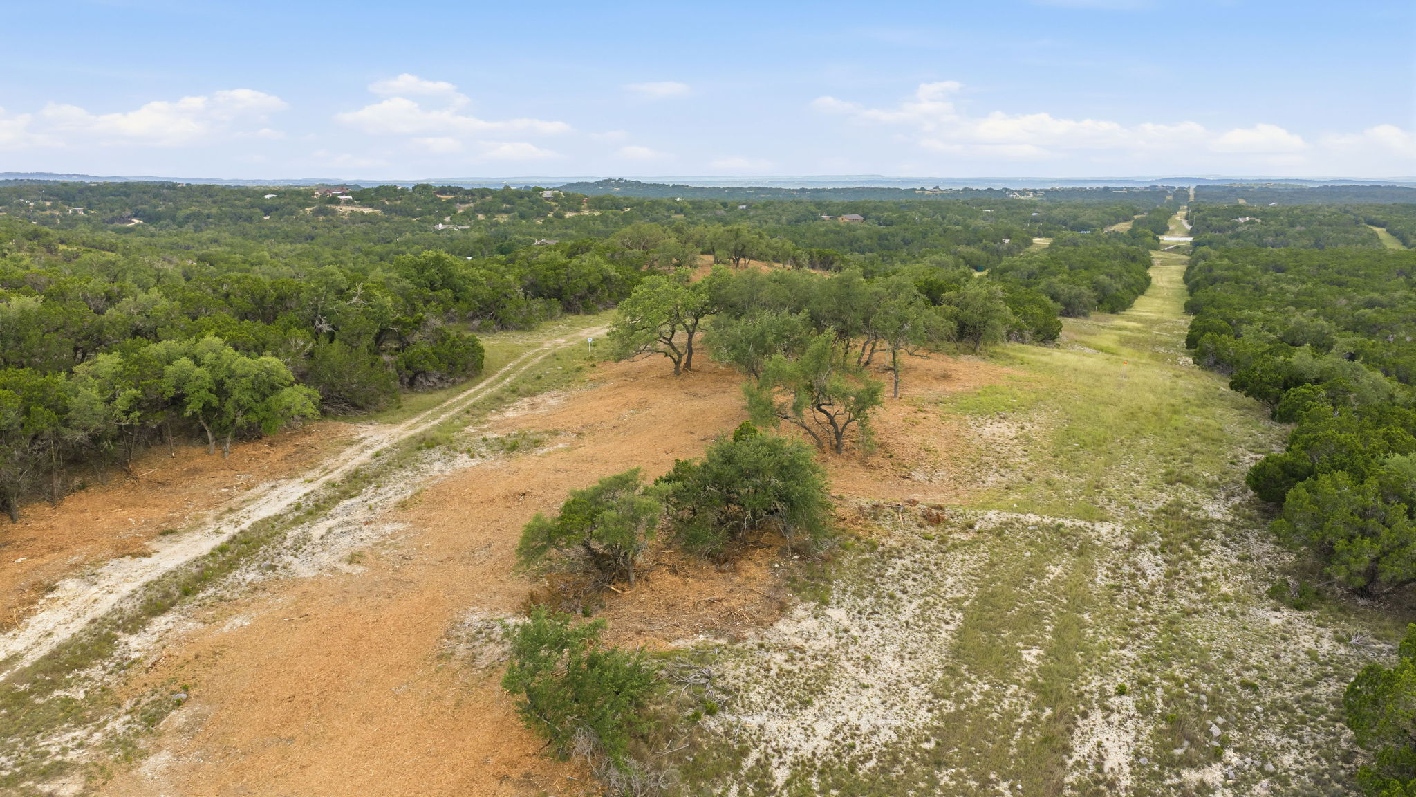 3230 West Fitzhugh Road Dripping Springs, TX 78620 - Photo 31 of 34 A verdant landscape unfolds, offering a serene and untouched natural setting.