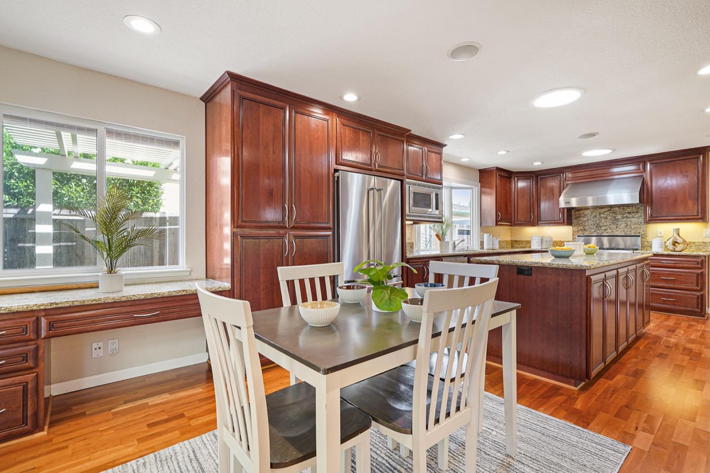 928 Lynn Court San Ramon, CA 94583 - Photo 11 of 43 a kitchen with stainless steel appliances granite countertop a stove top oven a sink and a refrigerator
