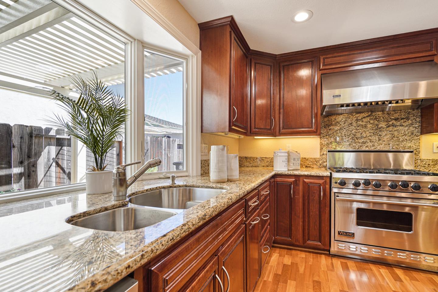 928 Lynn Court San Ramon, CA 94583 - Photo 13 of 43 a kitchen with granite countertop a sink and a stove