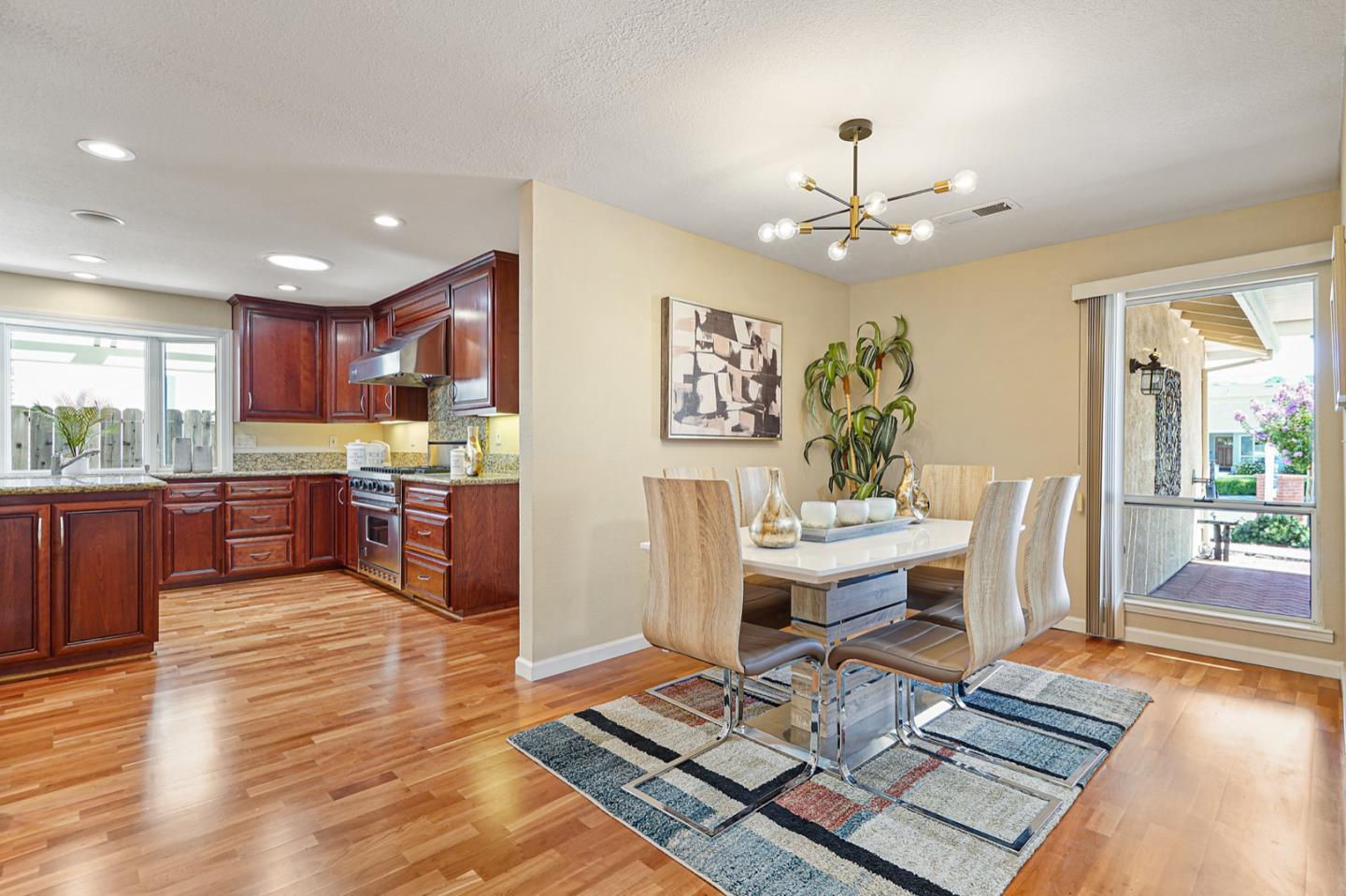 928 Lynn Court San Ramon, CA 94583 - Photo 5 of 43 a living room with stainless steel appliances furniture a rug kitchen view and a chandelier