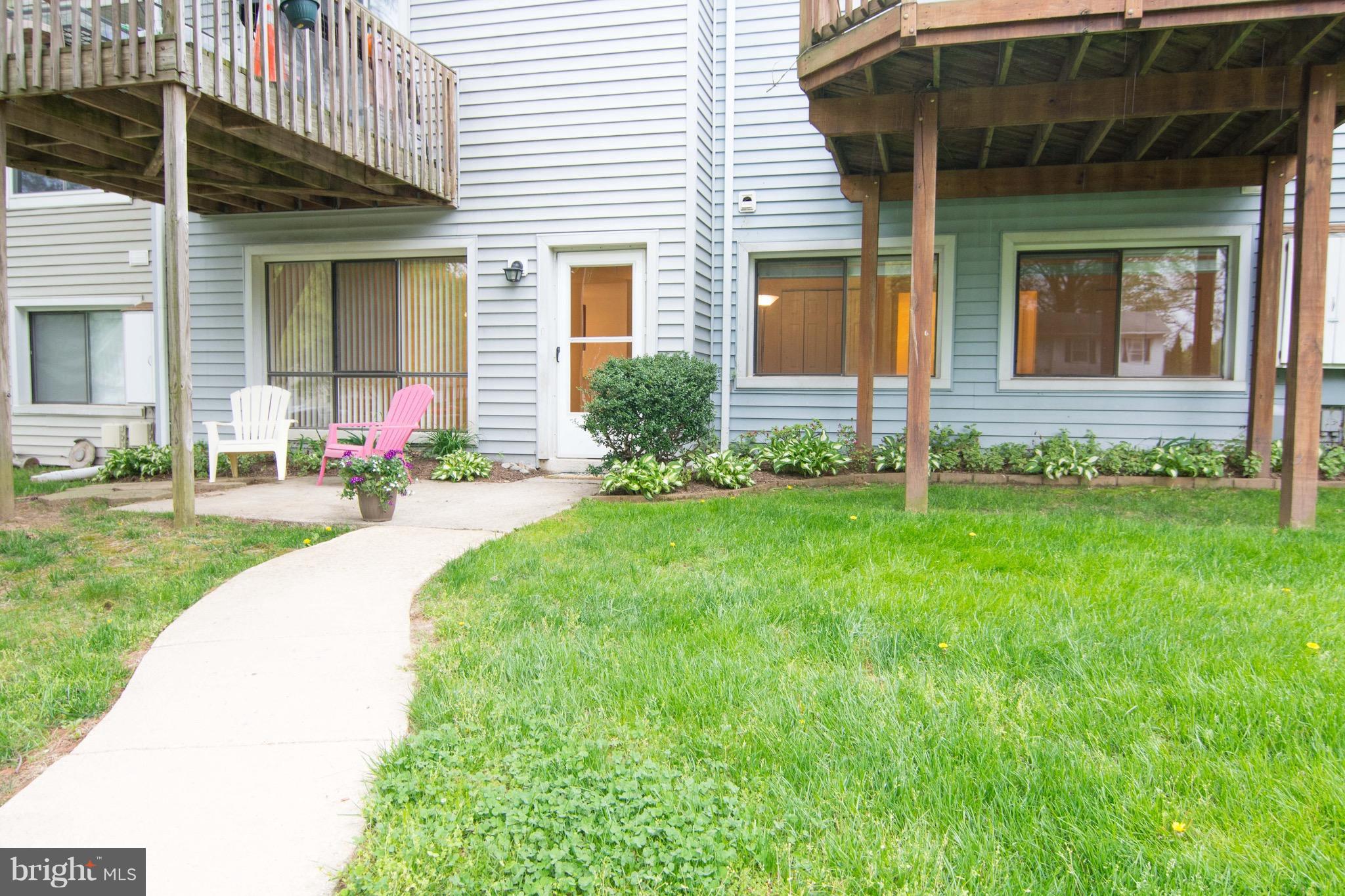 2221 Notely Lane Crofton, MD 21114 - Photo 2 of 26 a front view of a house with a yard and potted plants