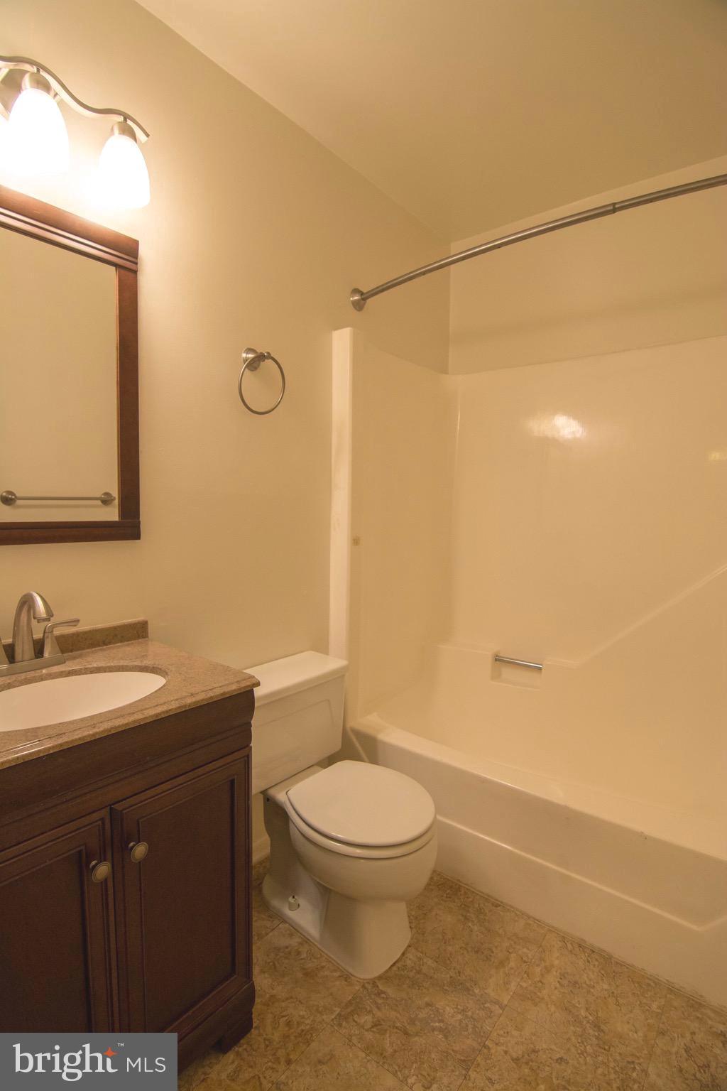 2221 Notely Lane Crofton, MD 21114 - Photo 15 of 26 a bathroom with a sink a toilet and shower