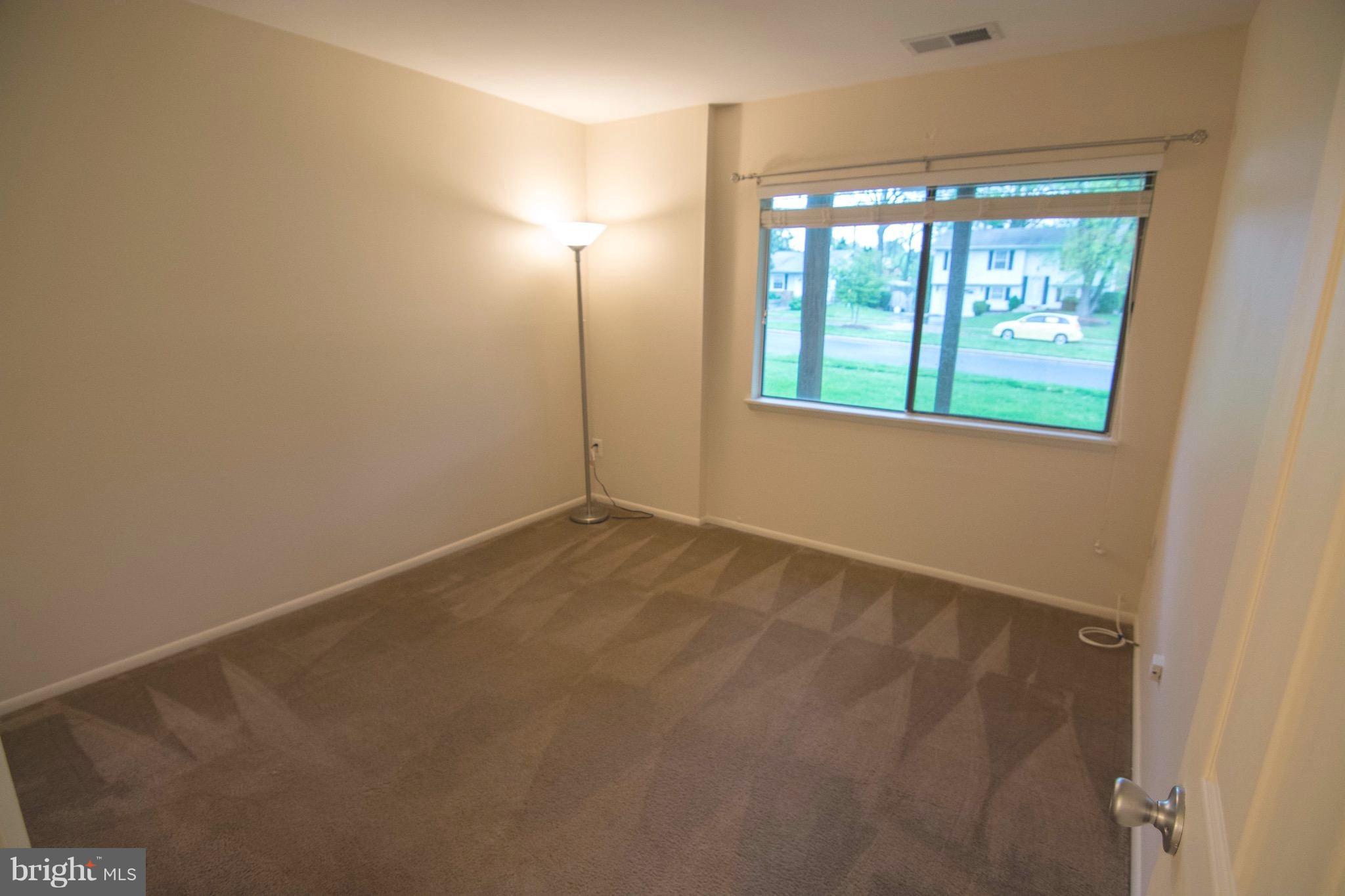 2221 Notely Lane Crofton, MD 21114 - Photo 16 of 26 an empty room with windows and closet