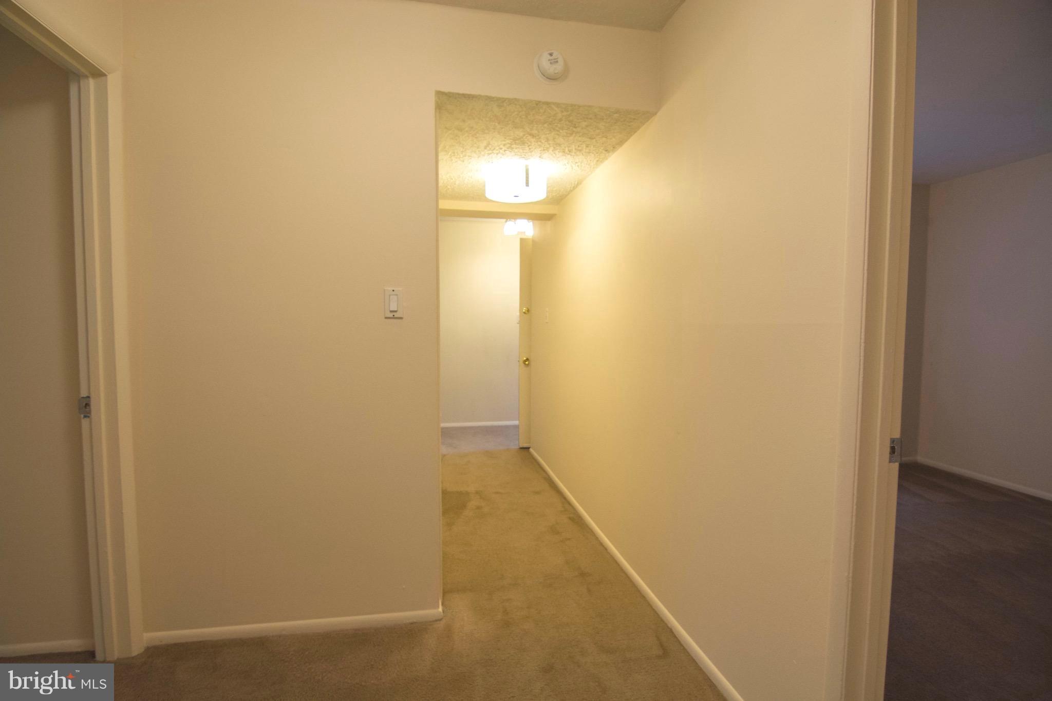 2221 Notely Lane Crofton, MD 21114 - Photo 20 of 26 a view of a hallway with wooden floor