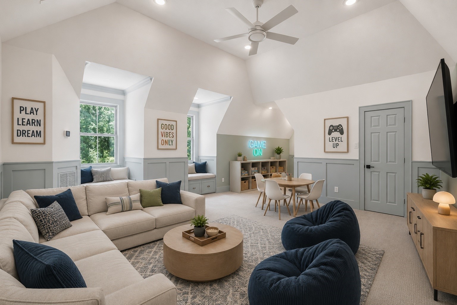 31 Hollymead Drive Spring, TX 77381 - Photo 40 of 50 Bright and spacious game room on the 2nd floor has vaulted ceilings, accent wainscoting, and neutral carpet. Features built-in window seats, recessed lighting, and a ceiling fan, creating a versatile space filled with natural light.