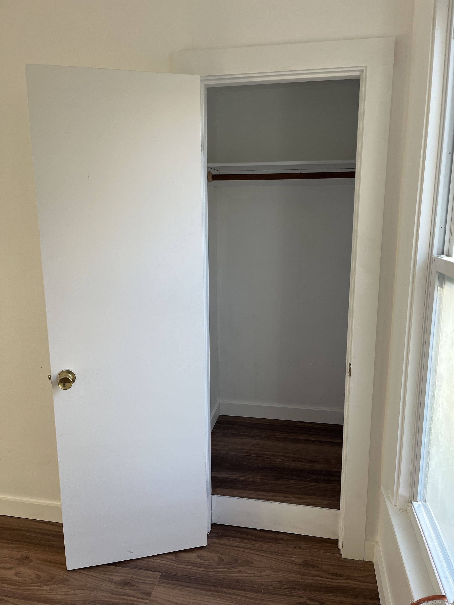 4 Orchard Street, Unit 2 Danbury, CT 06810 - Photo 5 of 7 a view of walk in closet with wooden floor