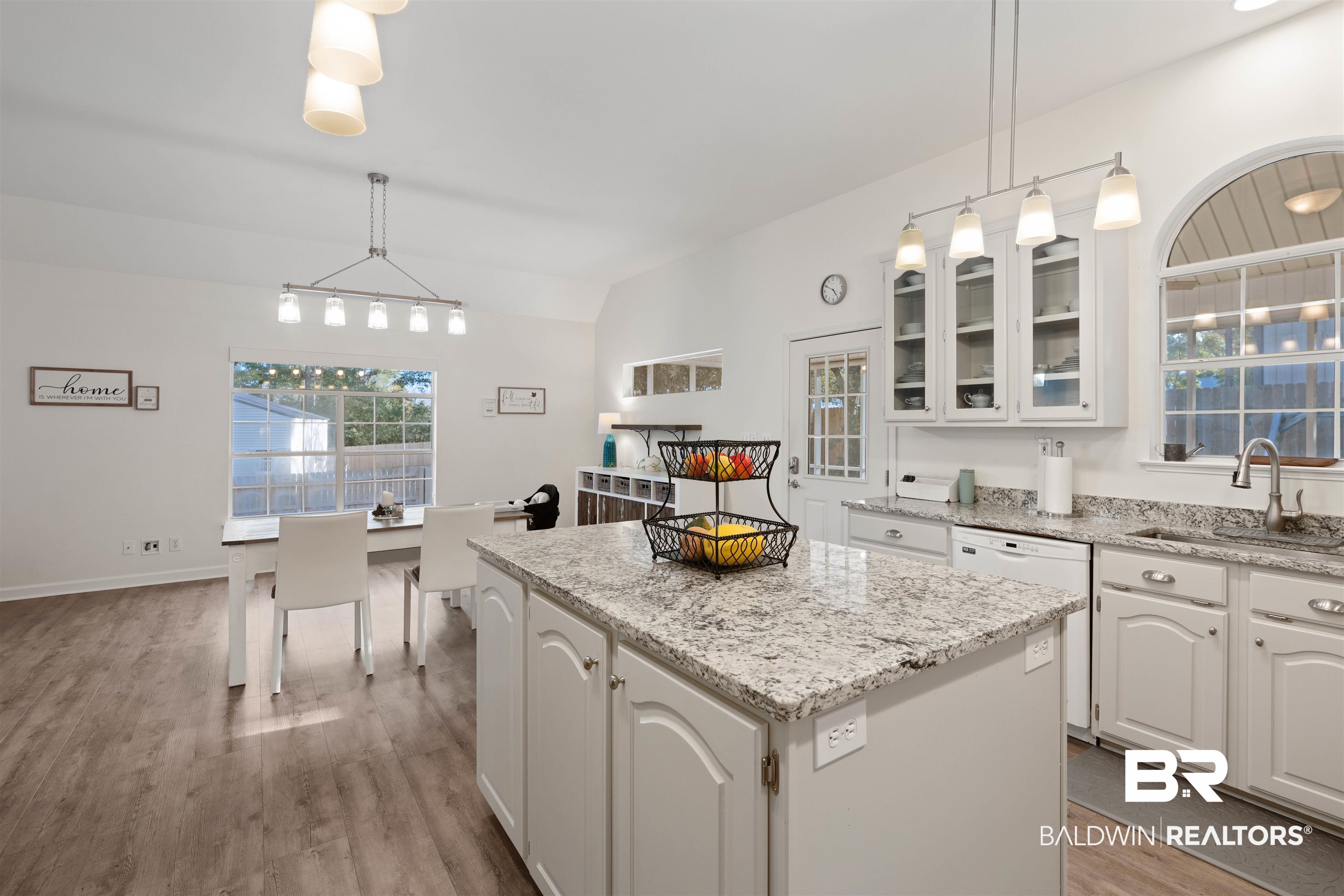 14631 Rdg Road East Summerdale, AL 36580 - Photo 14 of 46 Kitchen with a center island, sink, pendant lighting, and white cabinets