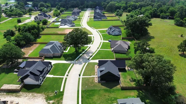 an aerial view of a house with outdoor space pool seating area and yard