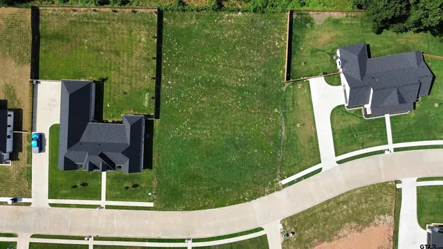 swimming pool view with a garden and outdoor seating