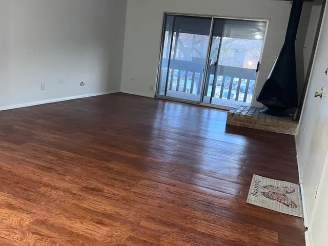 a view of an entryway with wooden floor