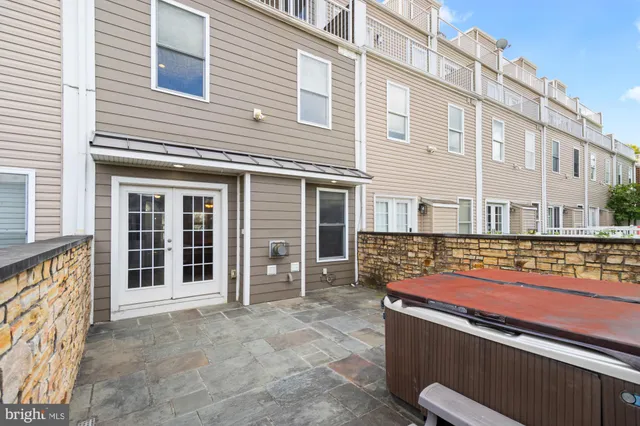 a view of a house with a wooden fence