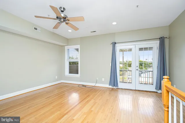 a view of a balcony with wooden floor