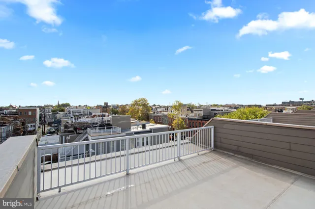 an empty room with closet and wooden floor