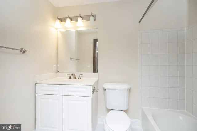 a view of hallway with wooden floor