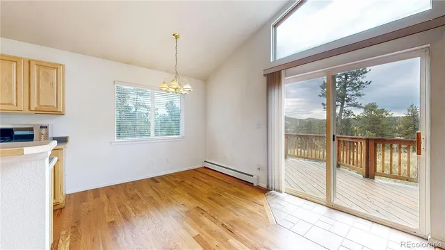a kitchen with a stove a sink and a microwave