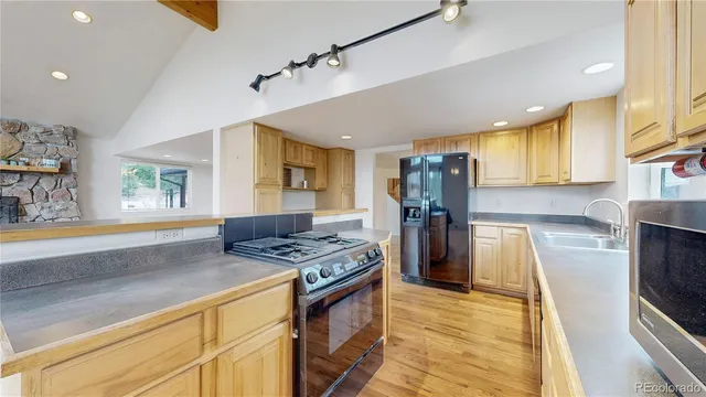 a view of balcony with wooden floor and outdoor seating