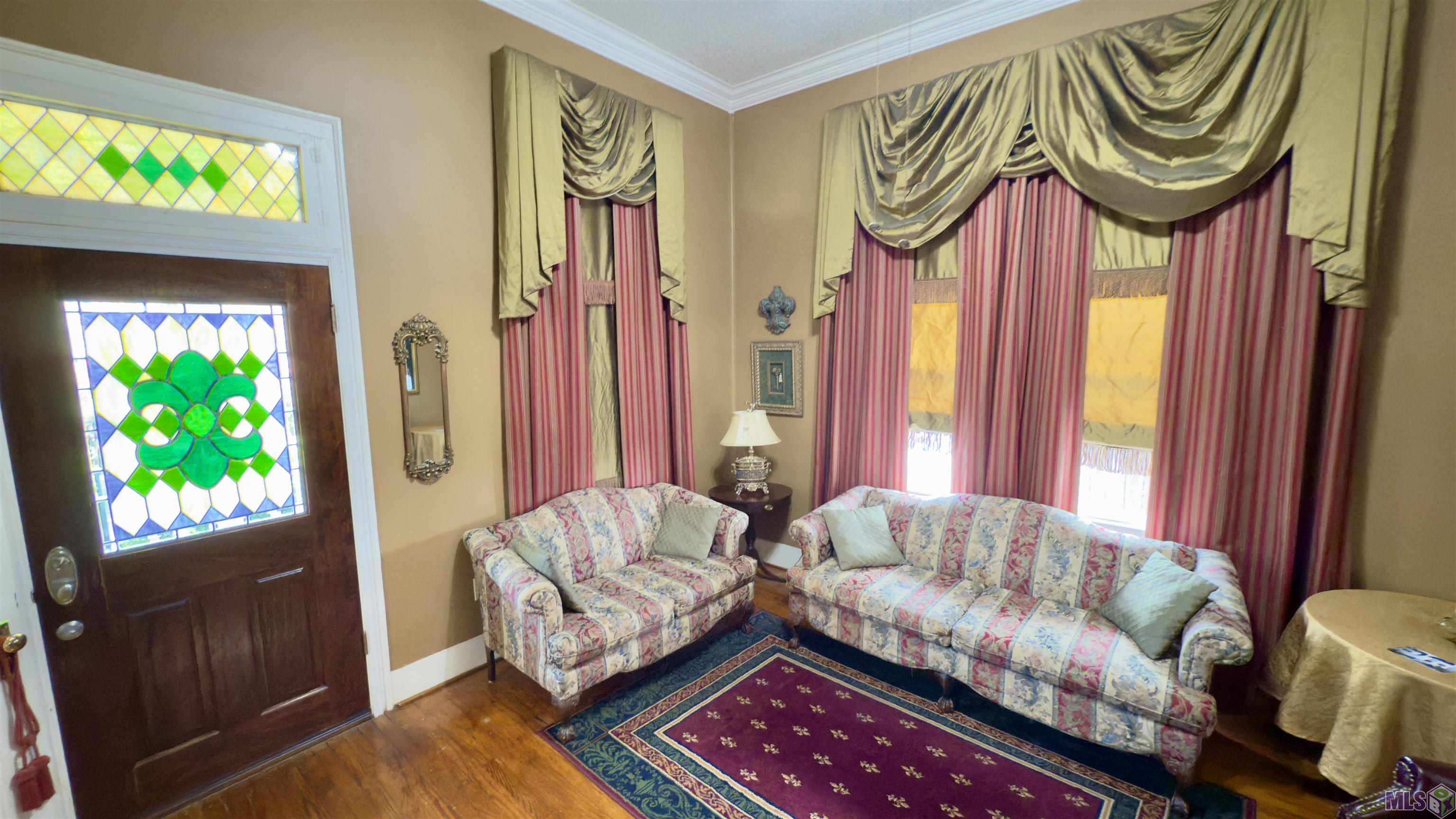 728 Europe Street Baton Rouge, LA 70802 - Photo 4 of 24 Living Room with Furniture & Drapes