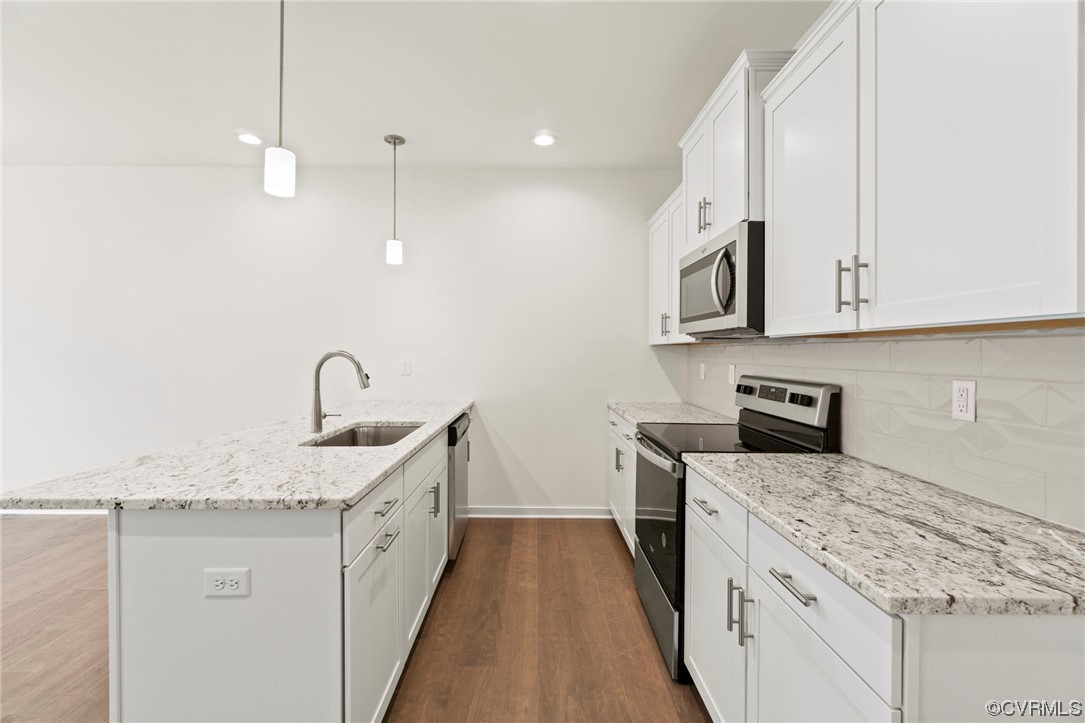 11252 Benton Pointe Way Chester, VA 23831 - Photo 11 of 26 a kitchen with stainless steel appliances granite countertop a sink and dishwasher a stove top oven with white countertops