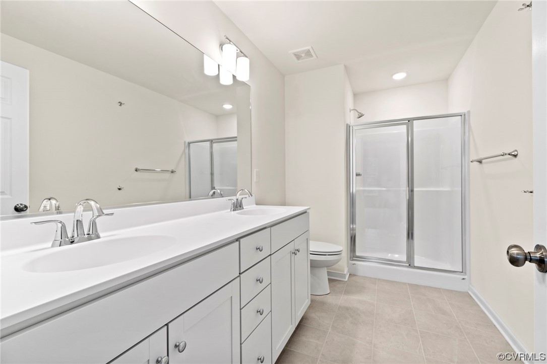 11252 Benton Pointe Way Chester, VA 23831 - Photo 20 of 26 a spacious bathroom with a double vanity sink mirror and double