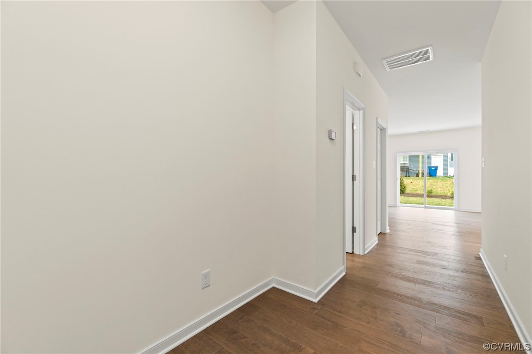 11252 Benton Pointe Way Chester, VA 23831 - Photo 4 of 26 a view of an empty room with wooden floor