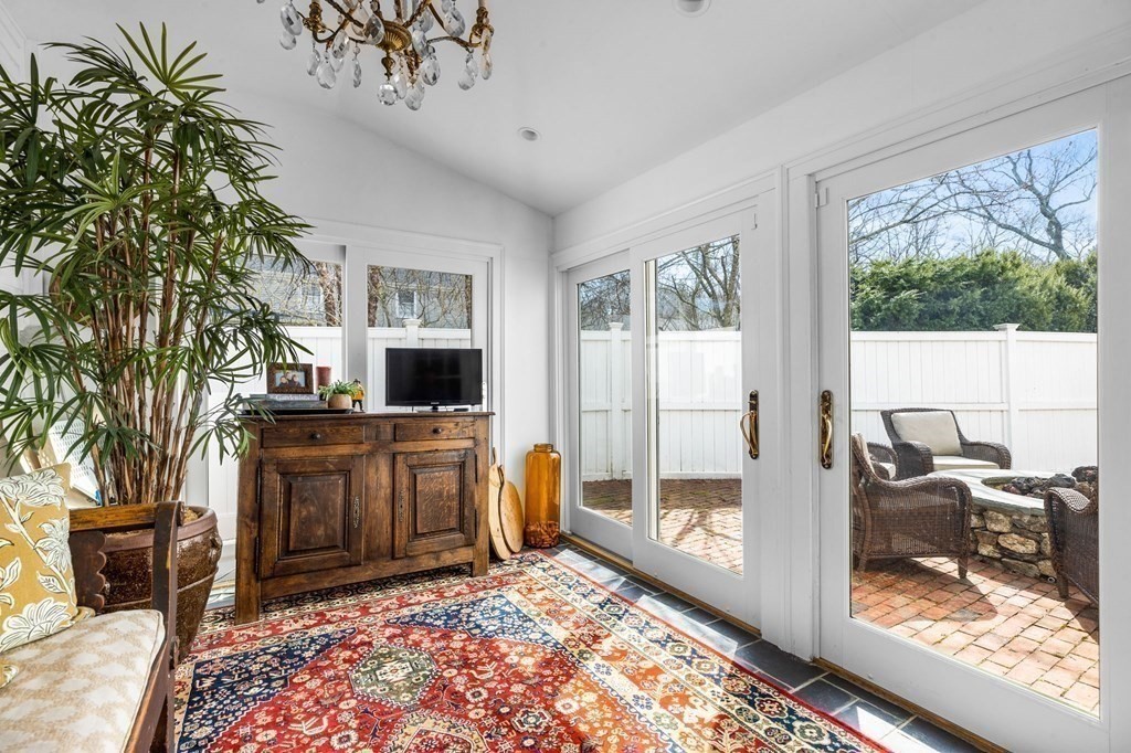 235 Main Street Hingham, MA 02043 - Photo 17 of 36 a living room with furniture a flat screen tv and a fireplace