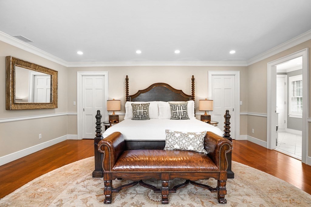 235 Main Street Hingham, MA 02043 - Photo 24 of 36 a spacious bedroom with a bed and wooden floor