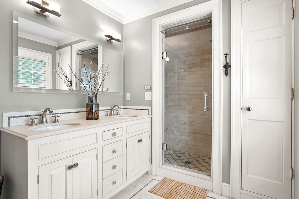 235 Main Street Hingham, MA 02043 - Photo 25 of 36 a bathroom with a granite countertop sink mirror and shower