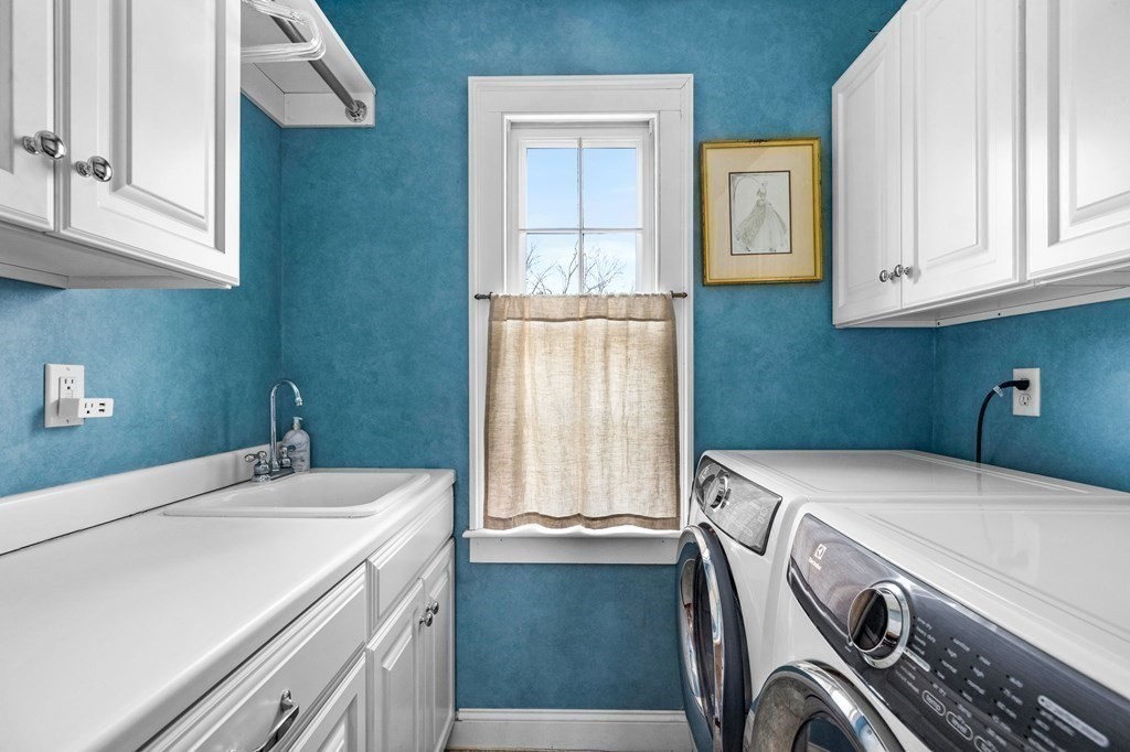 235 Main Street Hingham, MA 02043 - Photo 29 of 36 a bathroom with a sink and a washing machine
