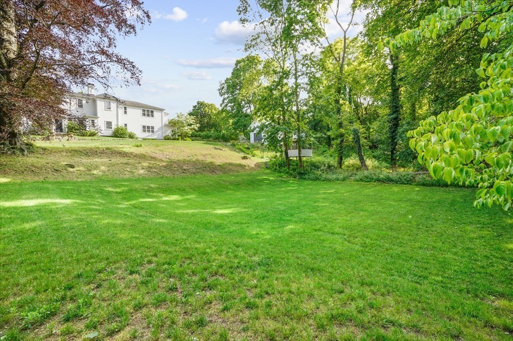 235 Main Street Hingham, MA 02043 - Photo 34 of 36 a view of green field with trees in the background