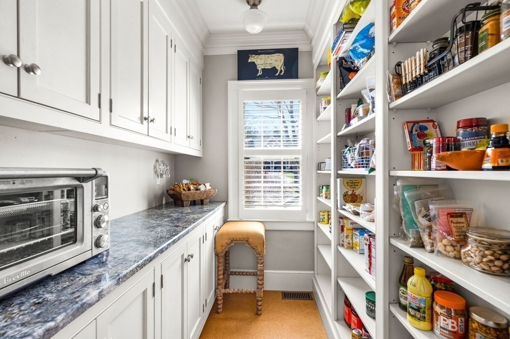 235 Main Street Hingham, MA 02043 - Photo 9 of 36 a kitchen with stainless steel appliances granite countertop a stove and a microwave