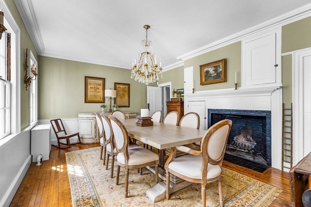 235 Main Street Hingham, MA 02043 - Photo 10 of 36 a dining room with furniture a chandelier and wooden floor