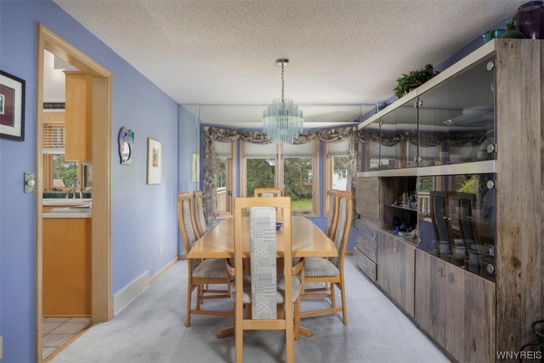 221 Rambling Road Amherst, NY 14051 - Photo 7 of 33 The formal Dinng Room is large enough for all of y