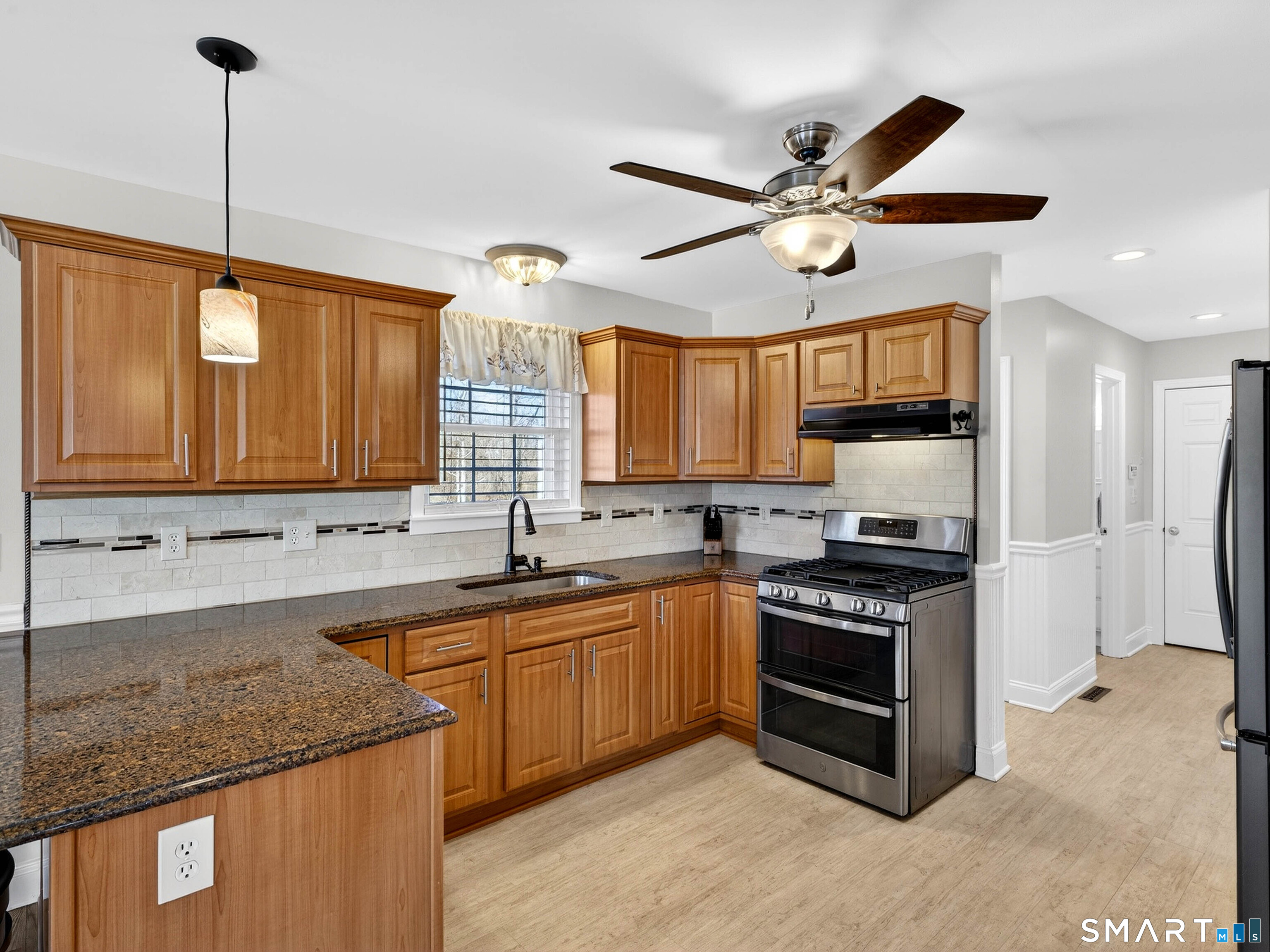 20 Colonial Heights Road East Haven, CT 06473 - Photo 12 of 39 a kitchen with a sink stainless steel appliances and cabinets
