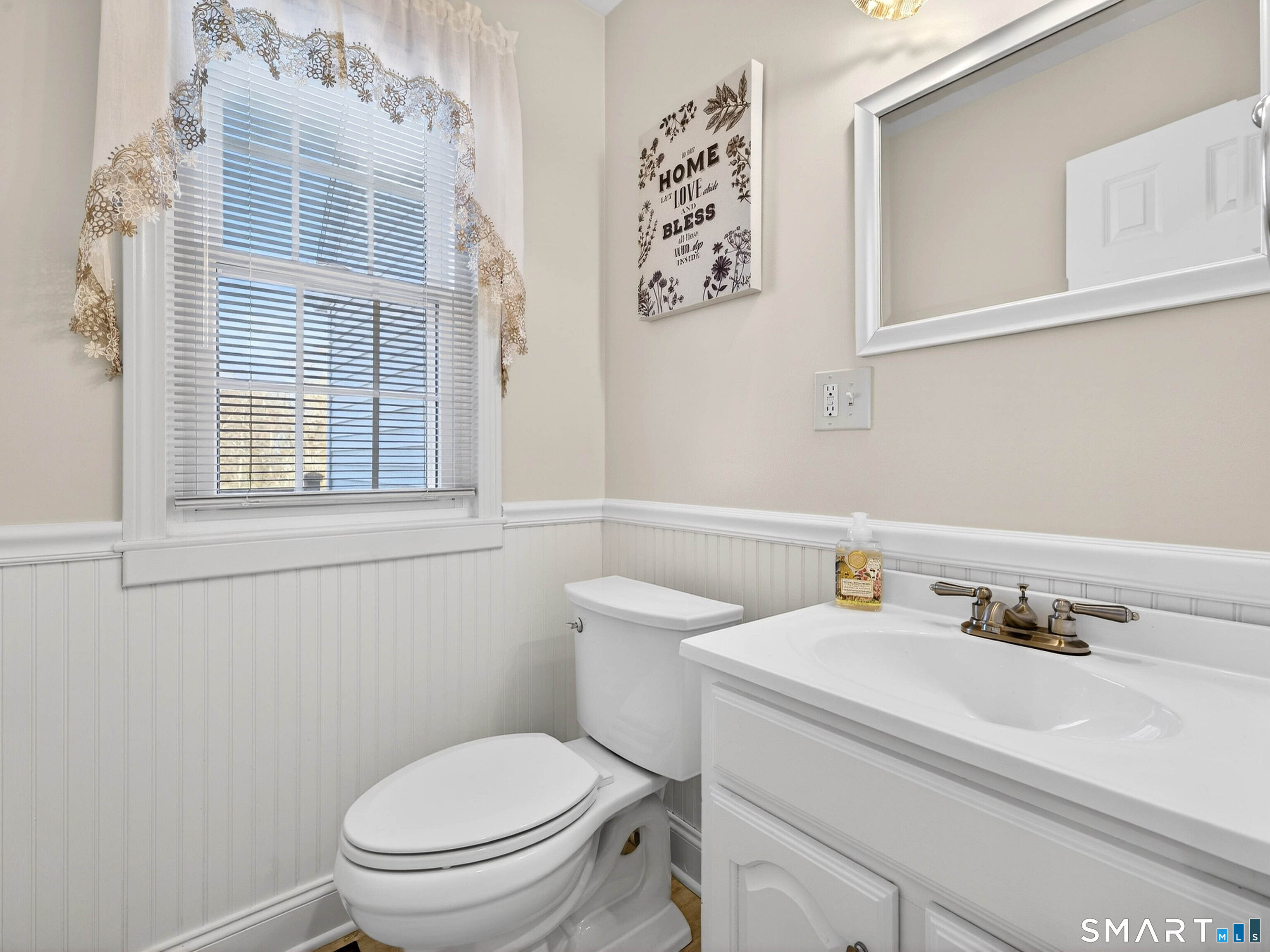 20 Colonial Heights Road East Haven, CT 06473 - Photo 16 of 39 a bathroom with a toilet sink and mirror