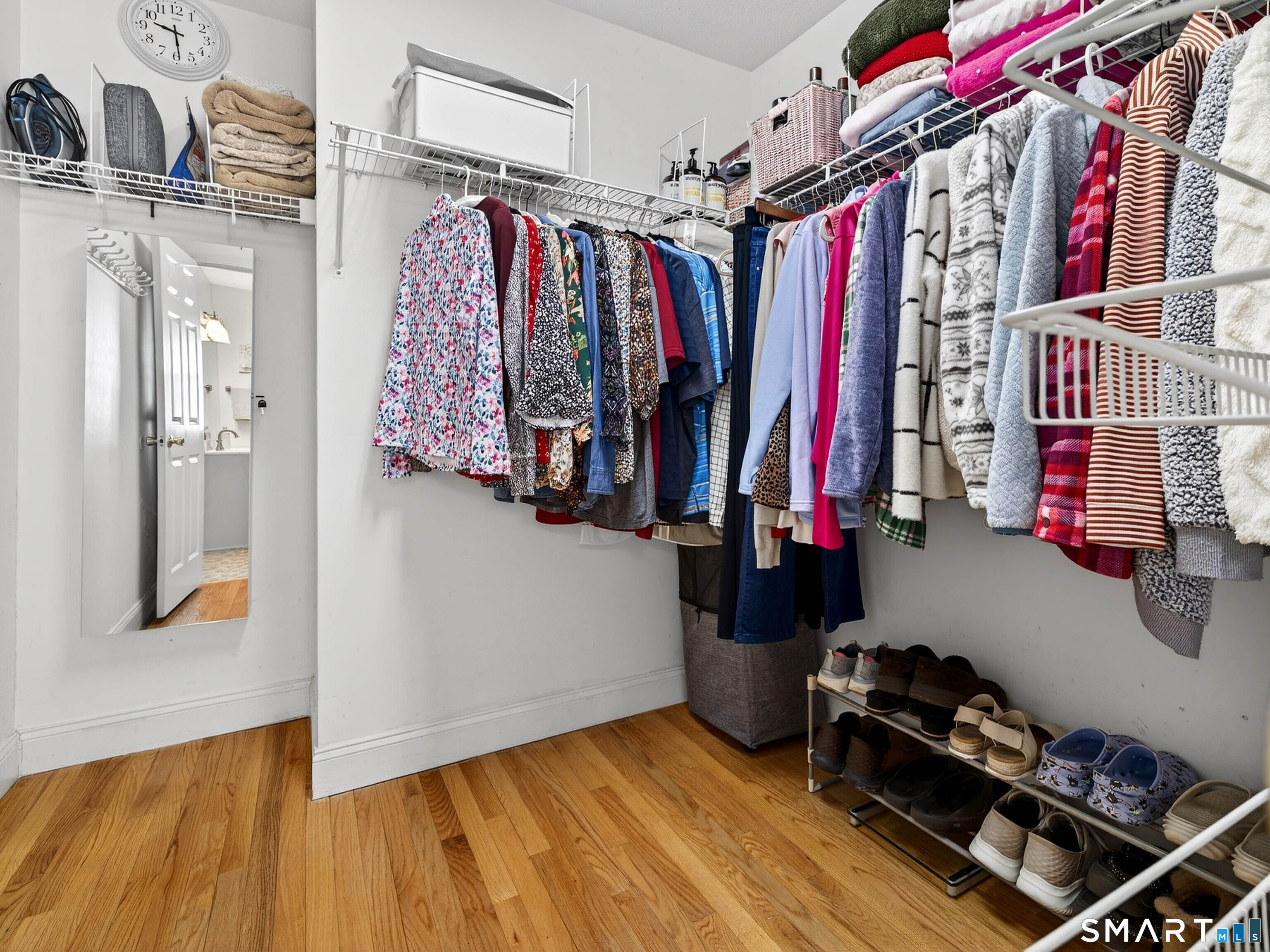 20 Colonial Heights Road East Haven, CT 06473 - Photo 19 of 39 a view of walk in closet with clothes and shoes